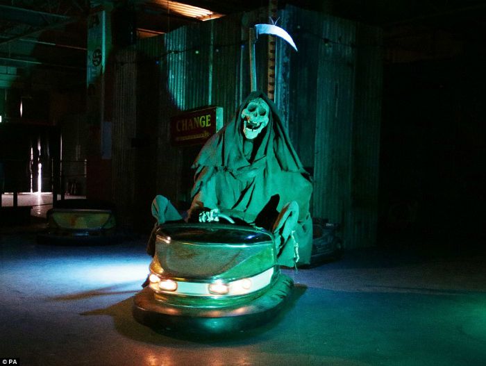 Grim reaper driving dodgem at Banksy's Dismaland