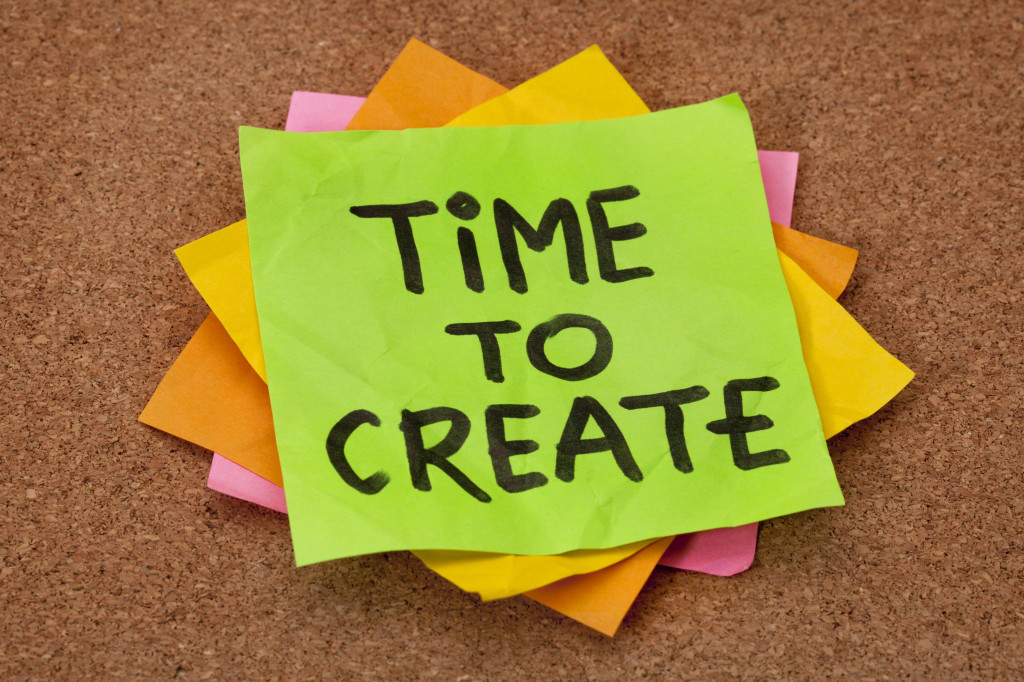 creativity concept - time to create reminder on a stack of stick